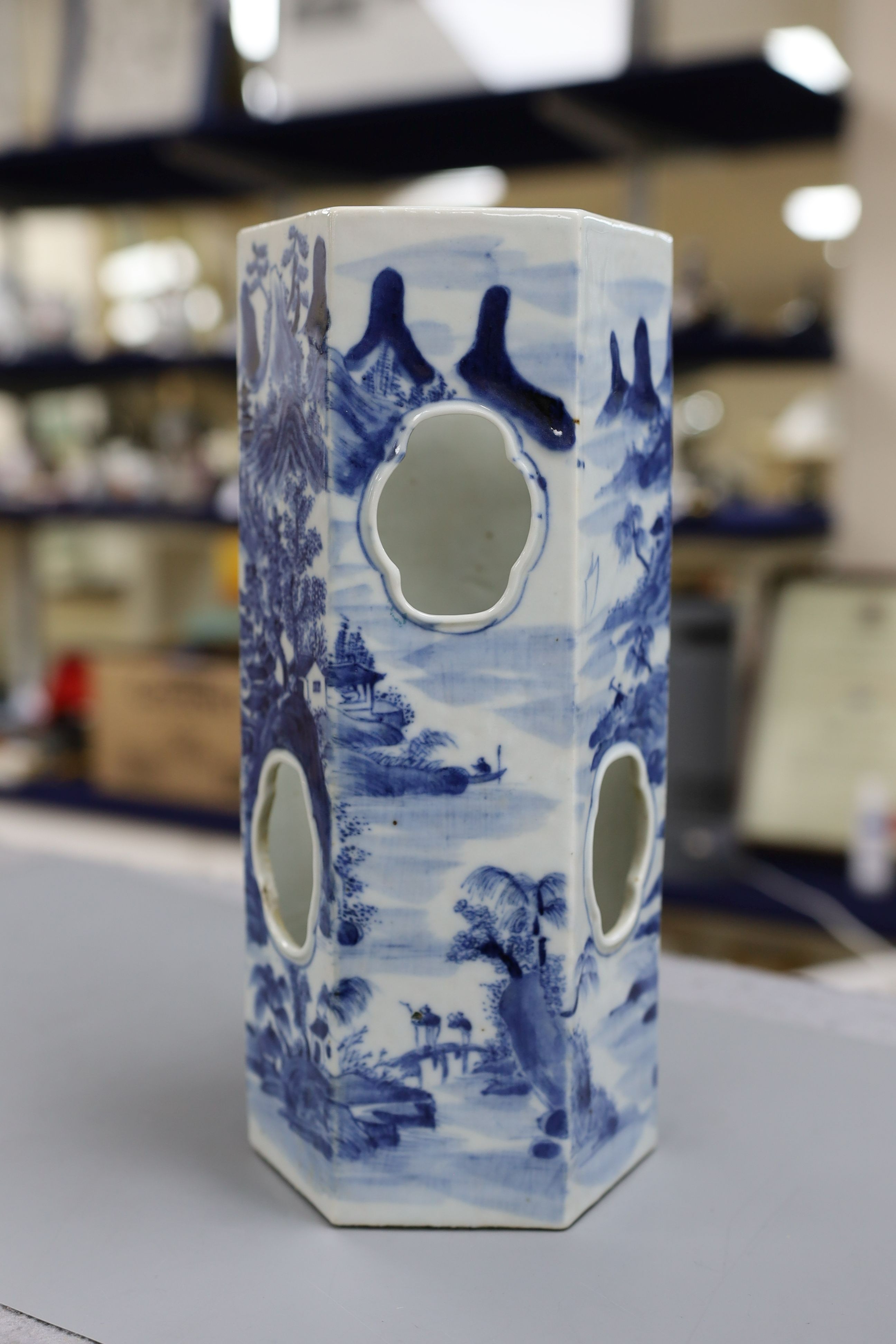 A Chinese blue and white hexagonal hat stand, late 19th century, 27.5 cms high, 27.2 cm high, hairline crack to one side of body